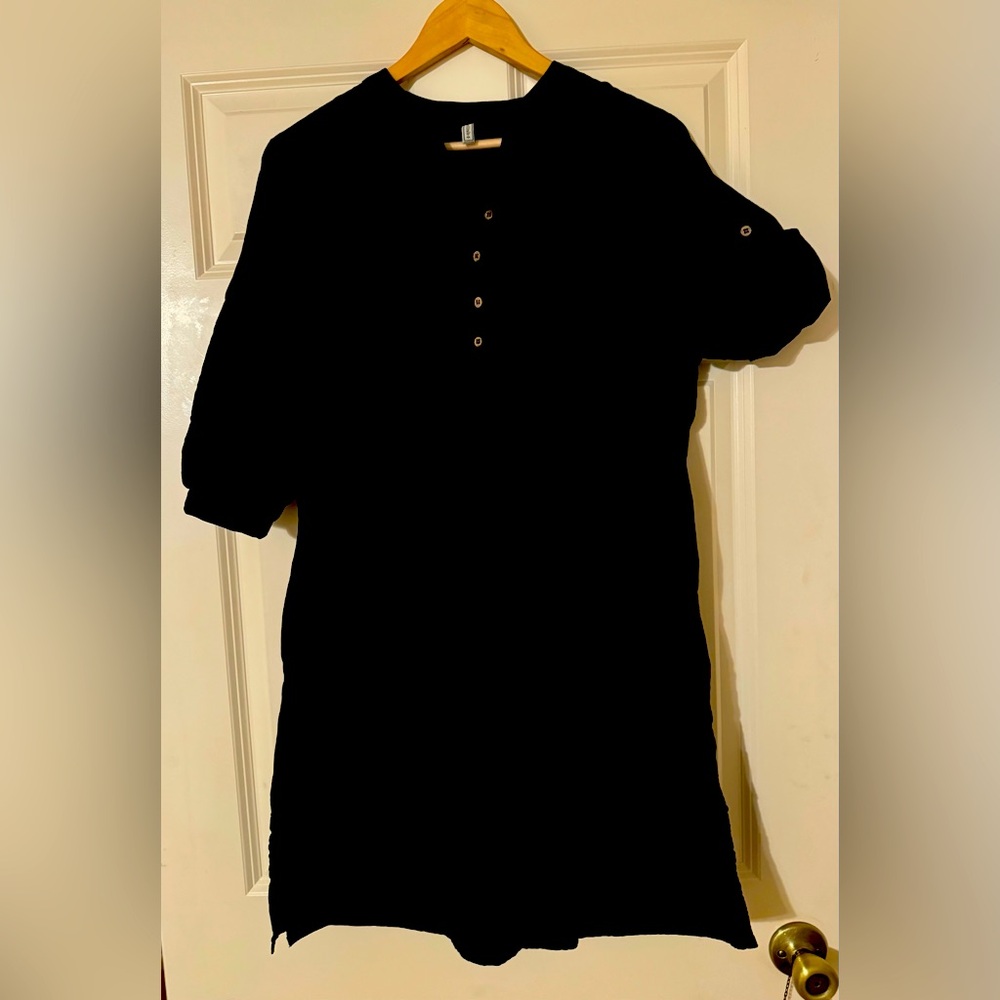 Black cotton dress with sewn in liner. 100% cotton, size medium.